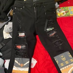 Black multi colored rips and patches on Amiri jeans size 34 in men
